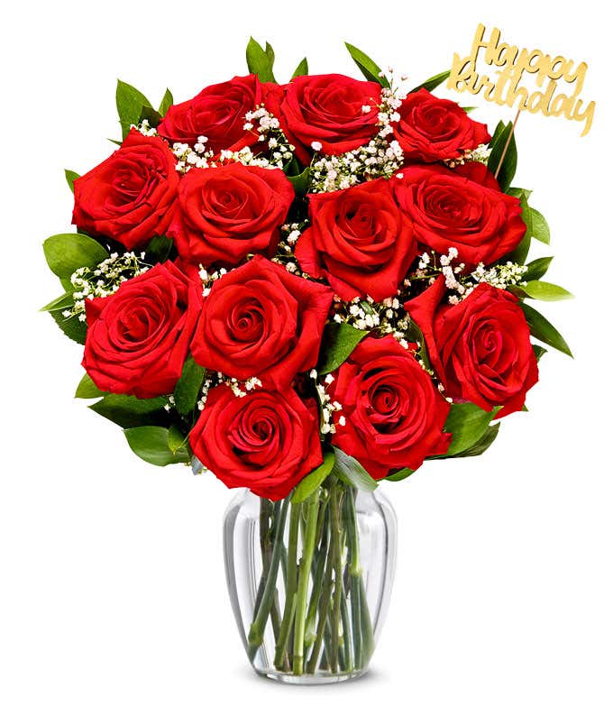 Red roses with baby's breath arranged with a gold Happy Birthday pick