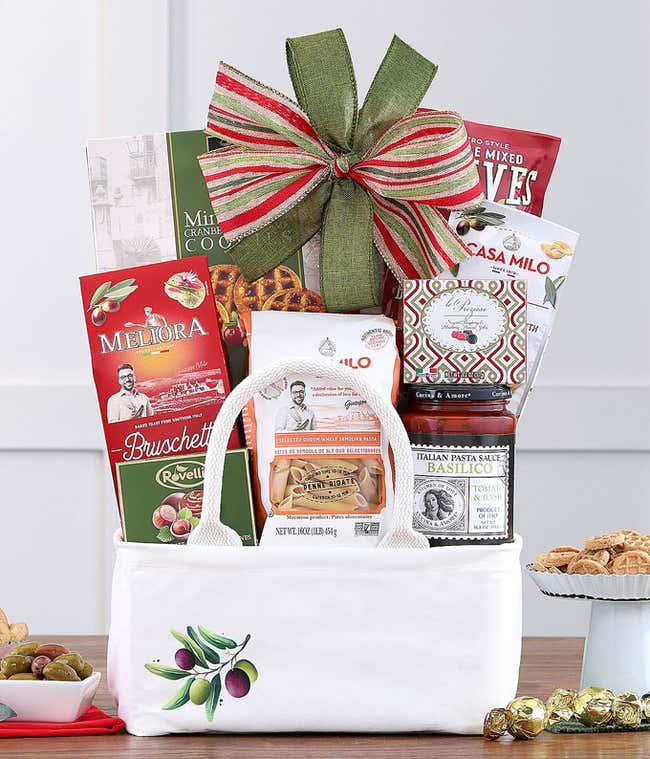 Gift basket with Italian gourmet treats and a green bow.