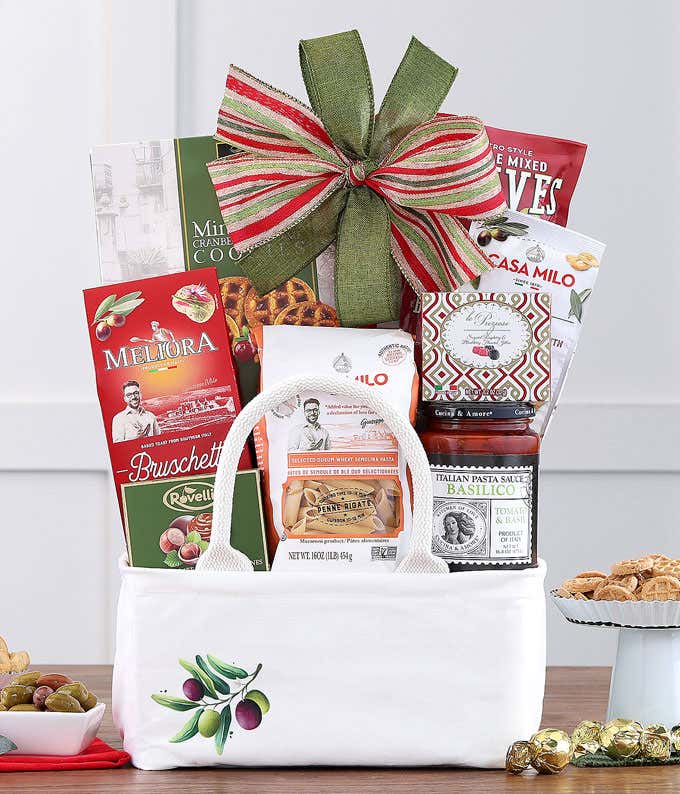 Gift basket with Italian gourmet treats and a green bow.