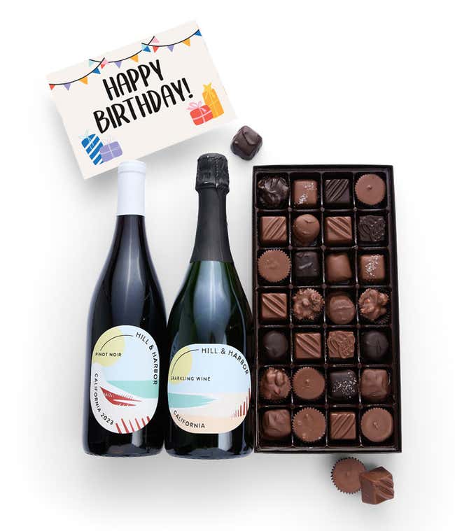 A gift box containing two bottles of California Wine - Pinot Noir &amp; Sparkling Wine, a 1 lb box of 28 assorted gourmet chocolates in a grid, and a birthday message card.   A refined combination perfect for birthday celebrations.